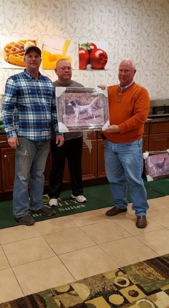Bill Phelps receiving the Club Championship portrait for Daisy from Bill Butler and Tim Powell — with Timothy Powell and Harry Lyness.