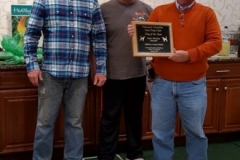 Bill Phelps receiving the 2016-2017 Open Dog Of The Year plaque from President Bill Butler and Vice President Tim Powell. — with Timothy Powell.