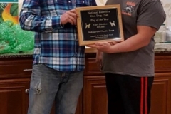 Timothy Powell receiving Dog of the Year Award 2017-2018 from President Bill Butler — with Timothy Powell and Billy Butler Sr..