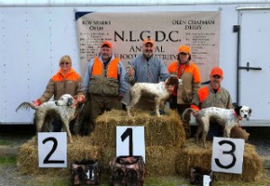 Saturday Puppy winners: 3rd Kellie Leaming with Dallas, Judge Jerry Idlett, 1st Bob Wilson with Gravy, Judge Caren Mansfield, 3rd Rafe Millard with Remi